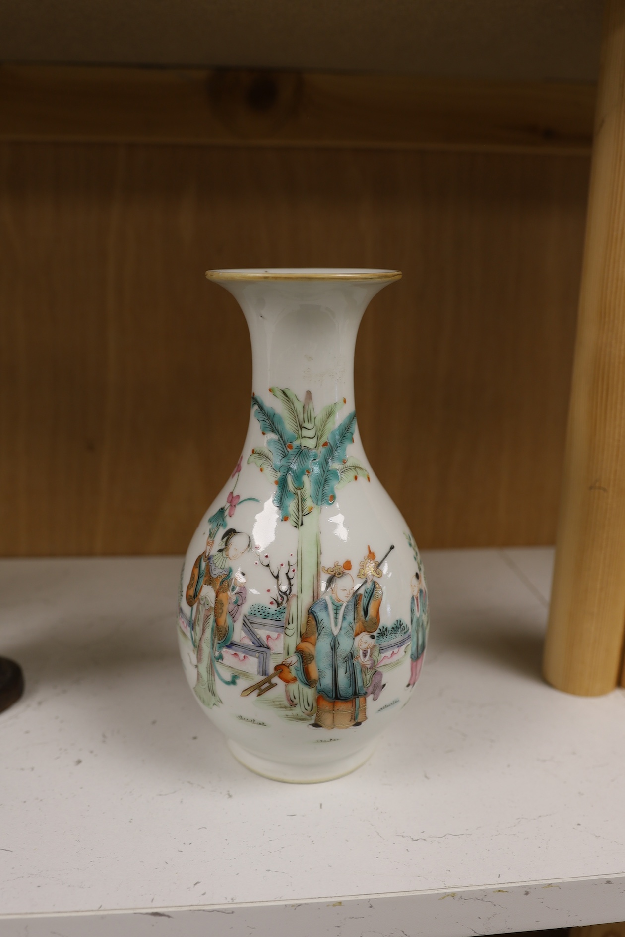 A Chinese porcelain famille rose vase, Qianlong red seal mark to the base, but early 20th century, 22cm high. Condition - good